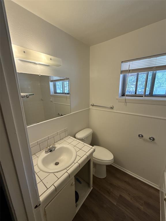 417 Judy Lane Canton, TX 75103 - Photo 10 of 12 a bathroom with a sink toilet and a mirror
