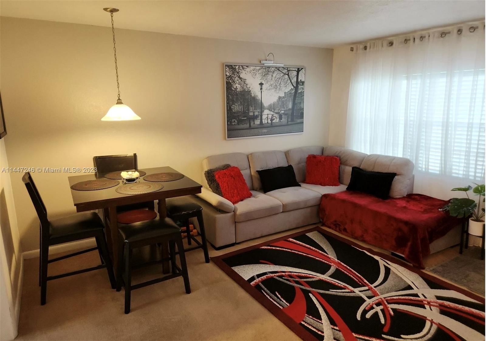770 Ridenhour Circle, Unit 770 Orlando, FL 32809 - Photo 2 of 10 a living room with furniture and a window