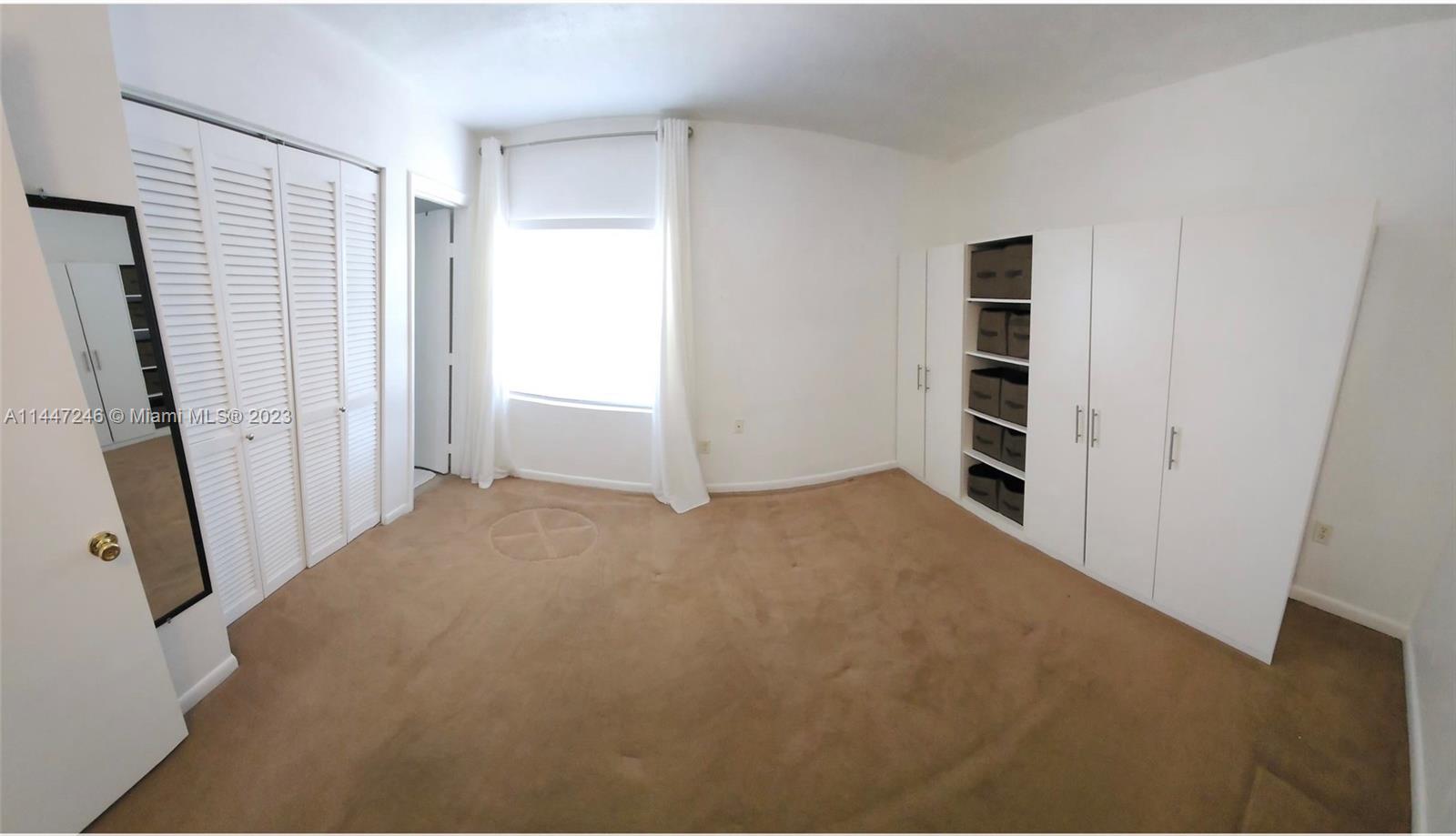 770 Ridenhour Circle, Unit 770 Orlando, FL 32809 - Photo 7 of 10 a view of empty room with front door