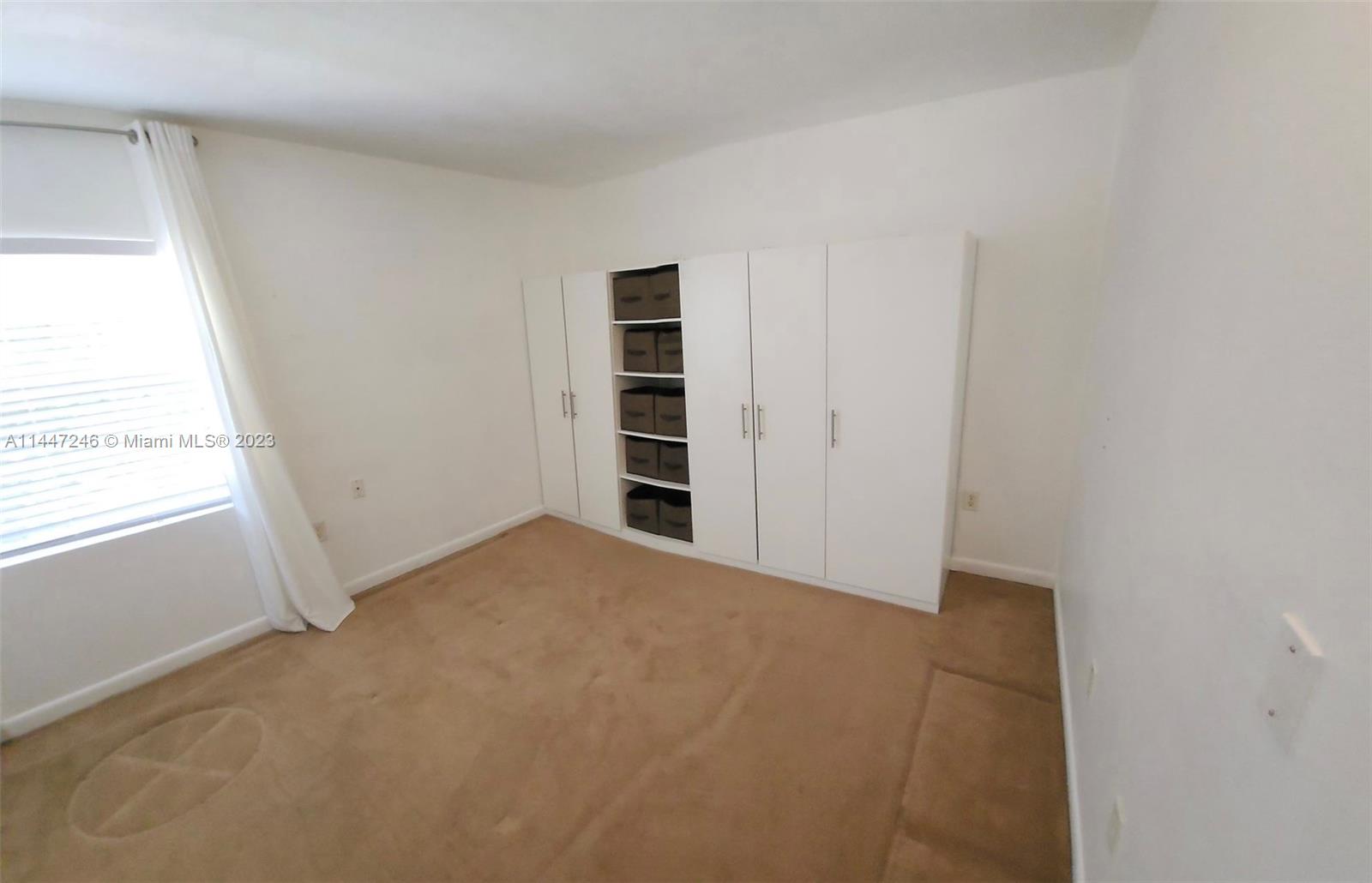 770 Ridenhour Circle, Unit 770 Orlando, FL 32809 - Photo 8 of 10 a view of an empty room with a window