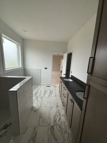 a view of kitchen with cabinets