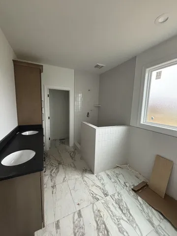 a bathroom with a sink and a vanity