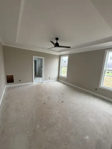 a view of an empty room with a window