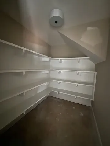 a view of an empty walk in closet