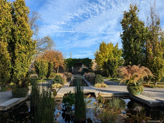 a view of a house with backyard porch and sitting area