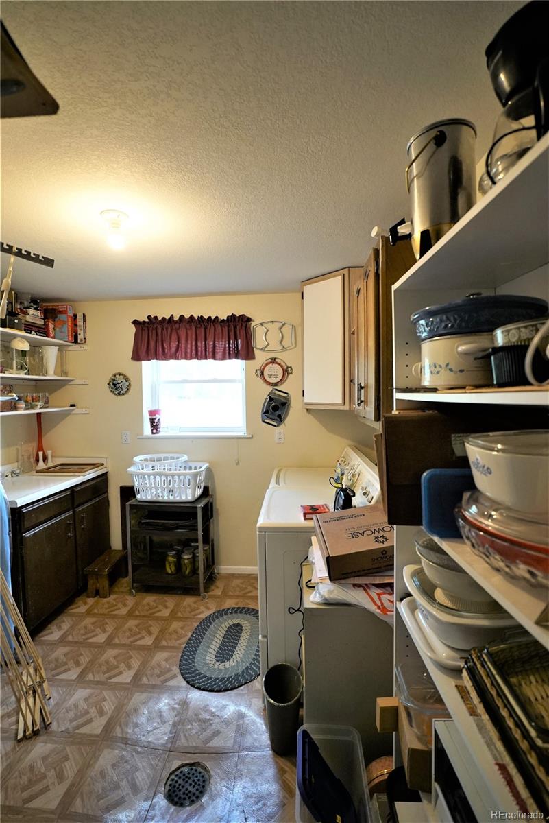 531 Rising Sun Road Bailey, CO 80421 - Photo 6 of 23 a room with furniture a rug and a window
