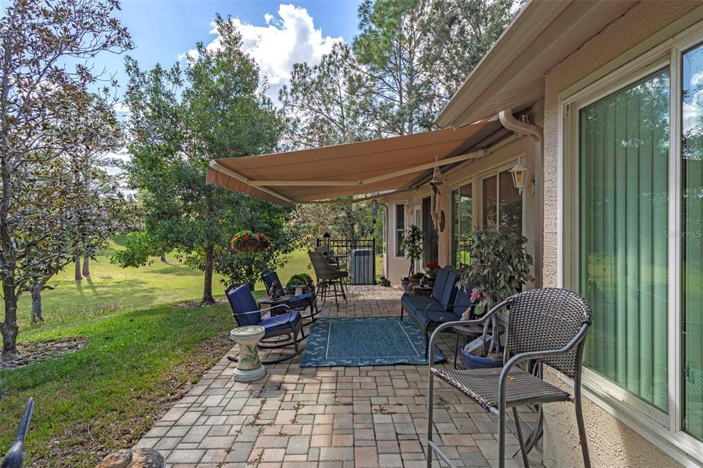 2102 Springmeadow Drive Spring Hill, FL 34606 - Photo 24 of 41 a view of a patio with chair and table and chairs