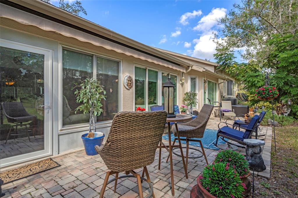 2102 Springmeadow Drive Spring Hill, FL 34606 - Photo 25 of 41 a view of a house with backyard sitting area and garden