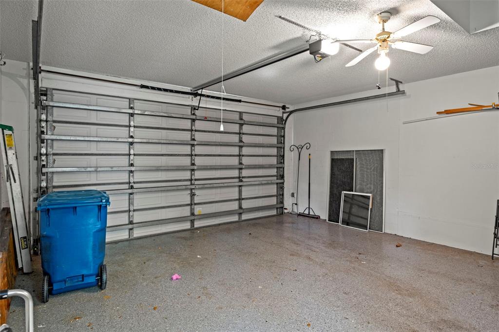 2102 Springmeadow Drive Spring Hill, FL 34606 - Photo 29 of 41 a view of a livingroom with furniture and a ceiling fan