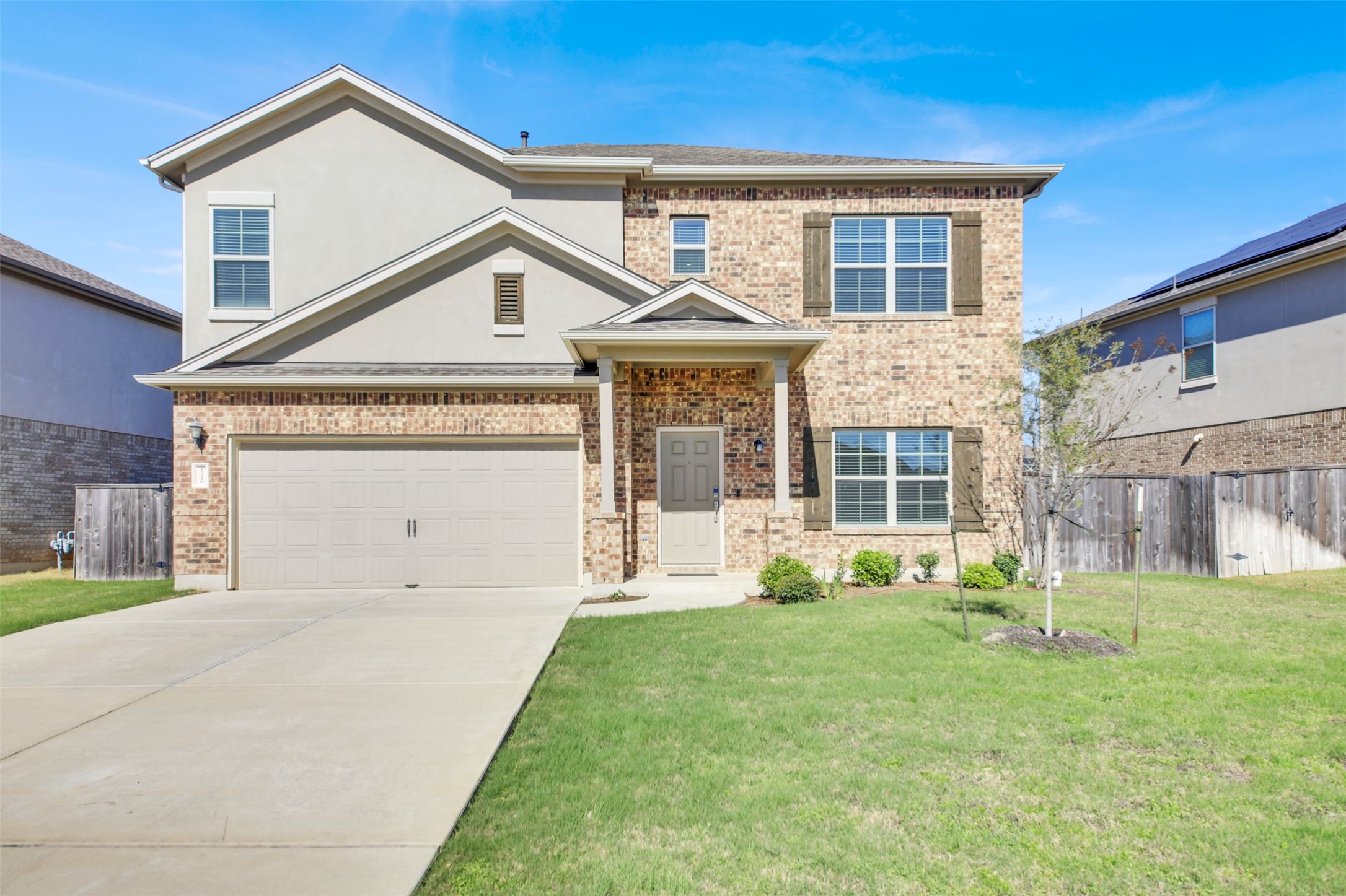 13716 Sugar Bush Path Manor, TX 78653 - Photo 2 of 37 View of front of property with driveway and brick siding