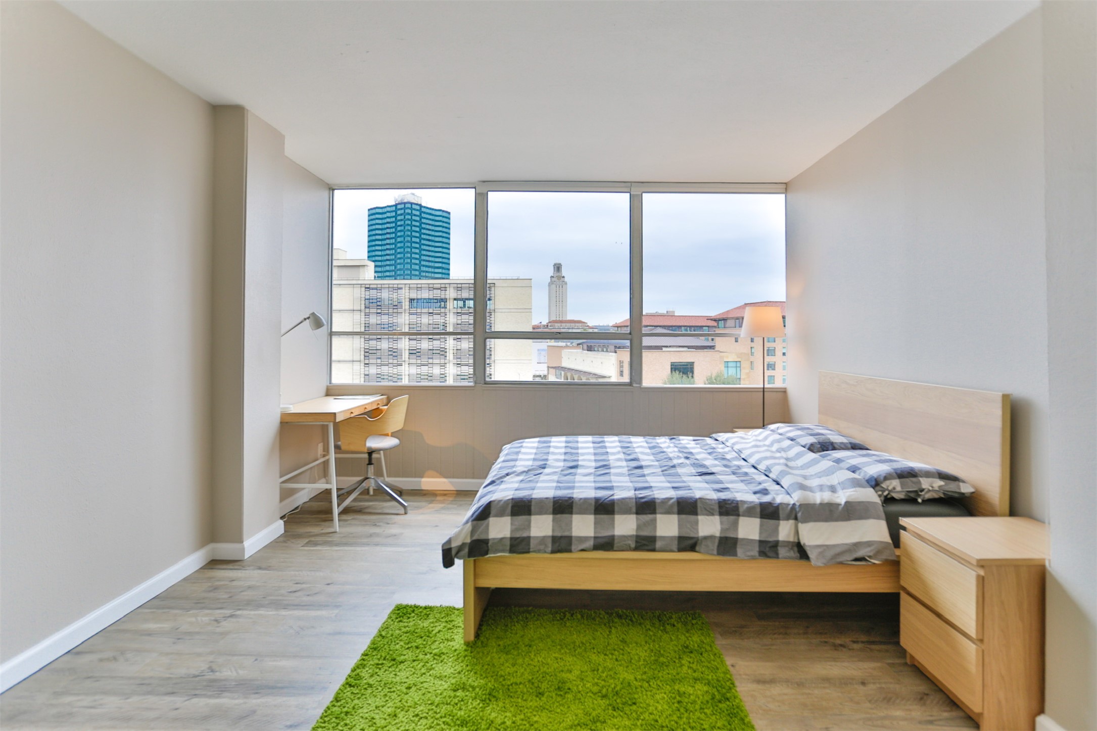 1800 Lavaca Street, Unit A608 Austin, TX 78701 - Photo 6 of 12 Bedroom featuring light wood finished floors and a city view