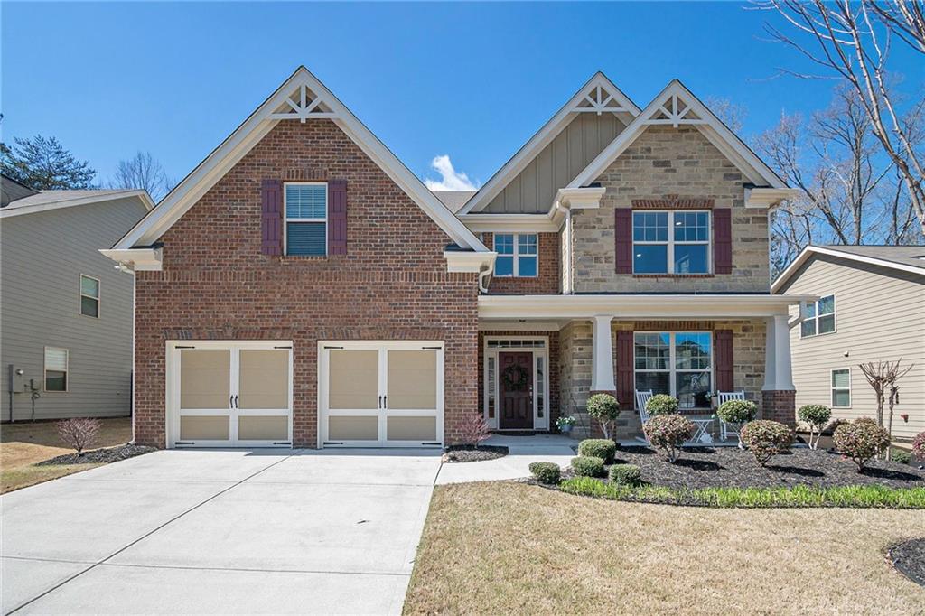 547 Rokeby Drive Woodstock, GA 30188 - Photo 1 of 1 a front view of a house with garden
