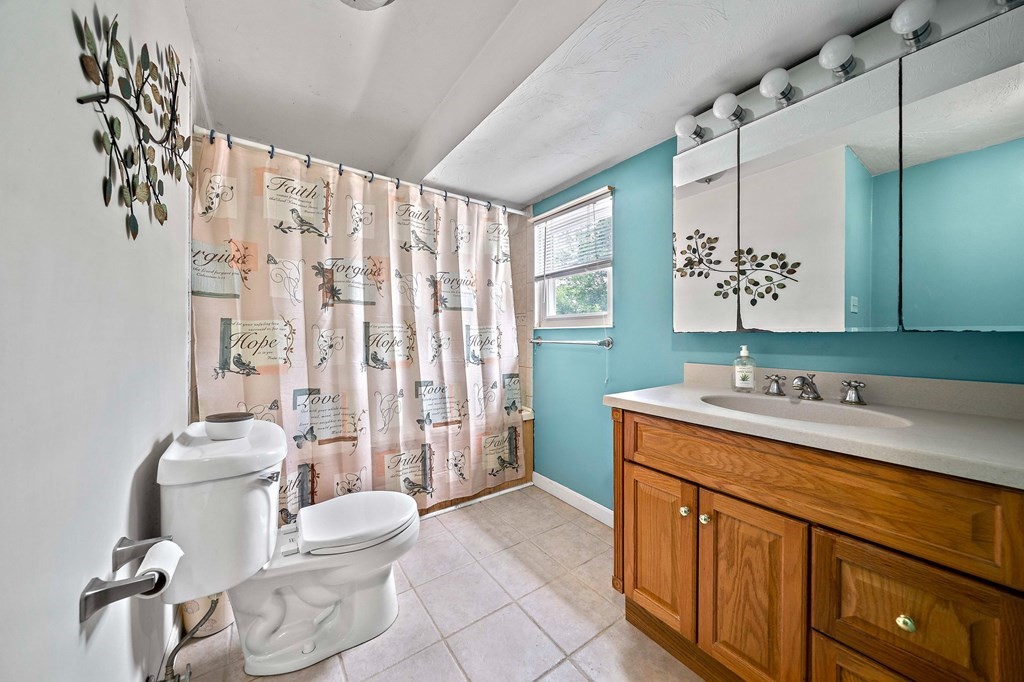 21 Alder Road Holbrook, MA 02343 - Photo 16 of 23 a bathroom with a granite countertop sink toilet and shower