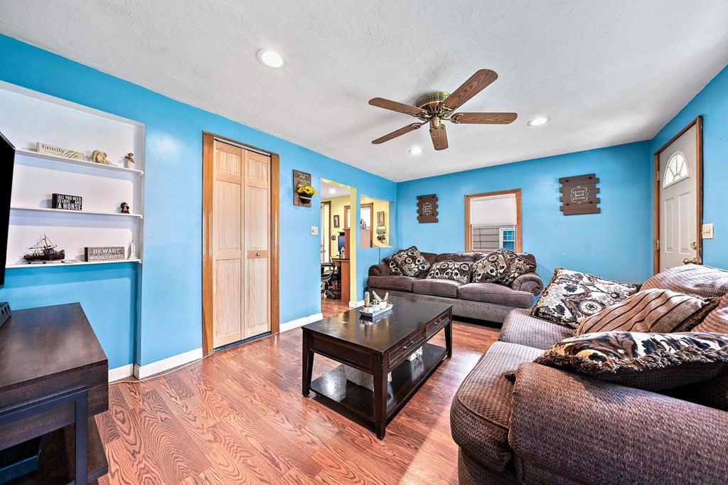 21 Alder Road Holbrook, MA 02343 - Photo 5 of 23 a living room with furniture and a flat screen tv