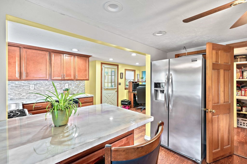 21 Alder Road Holbrook, MA 02343 - Photo 9 of 23 a kitchen with stainless steel appliances granite countertop a refrigerator a stove and a sink