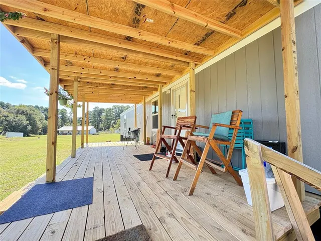 a view of a patio with swimming pool