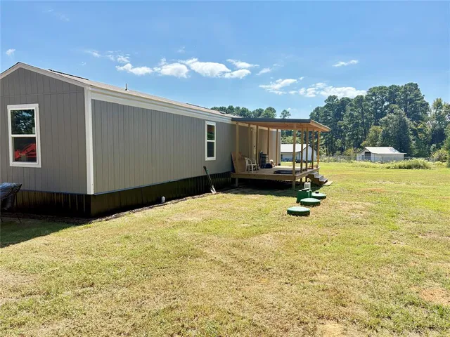 a view of a backyard of the house