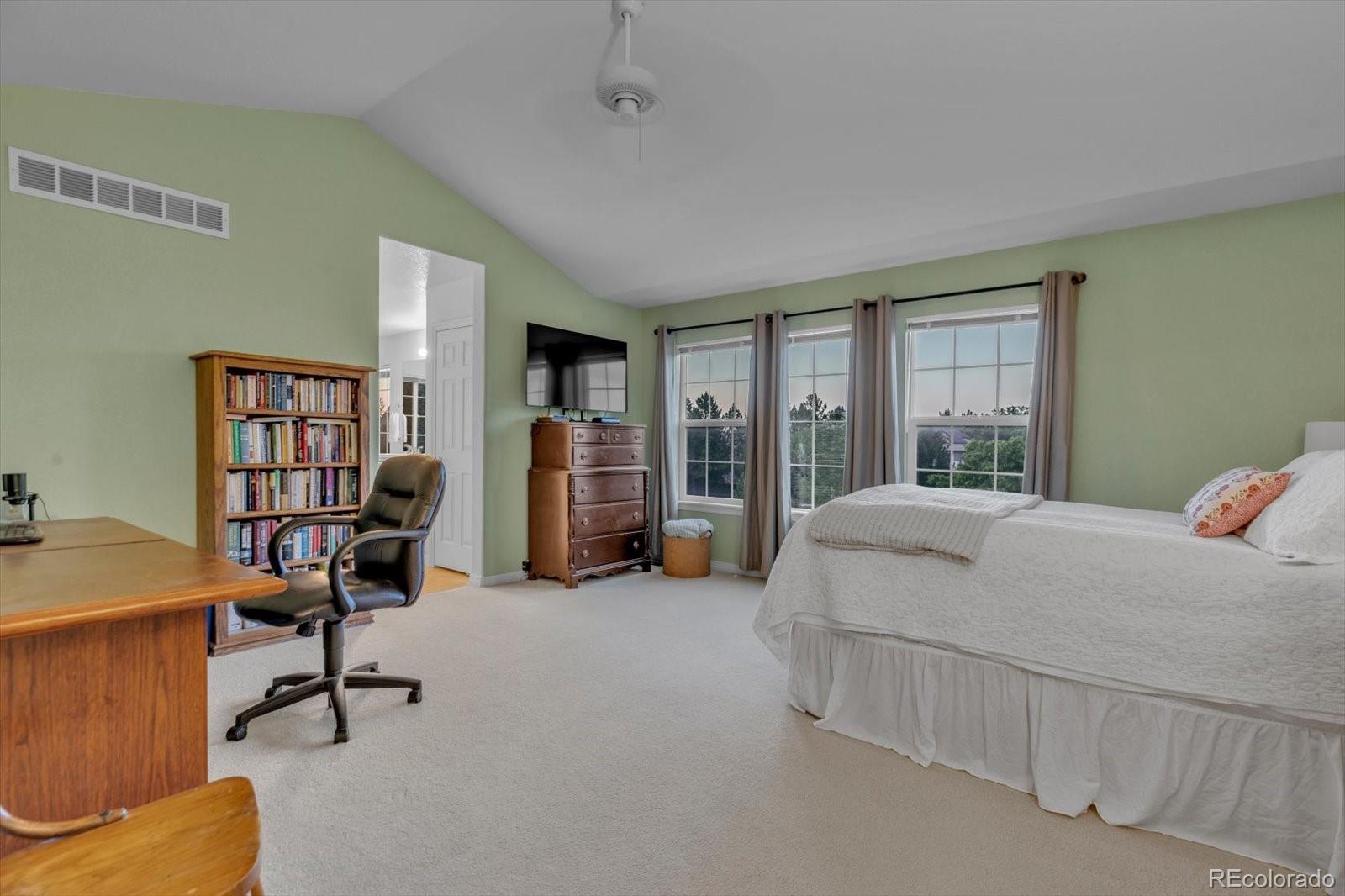 4786 Rabbit Mountain Road Broomfield, CO 80020 - Photo 17 of 41 a bedroom with furniture and a large window