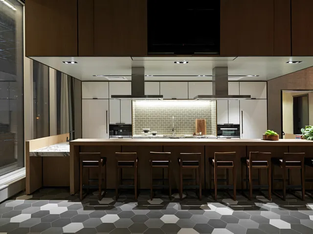 a kitchen with granite countertop a sink and cabinets