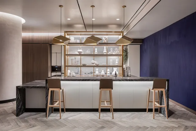 a kitchen with a table and chairs