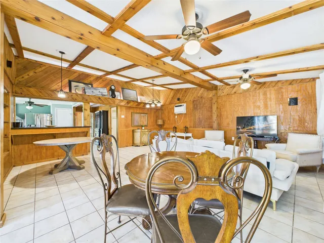 a view of a swimming pool with outdoor seating