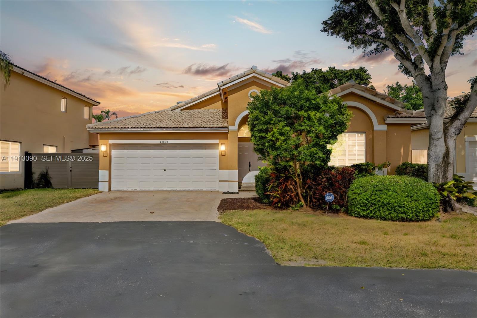 15475 Southwest 138th Terrace Miami, FL 33196 - Photo 2 of 31 a view of a house with a yard and potted plants