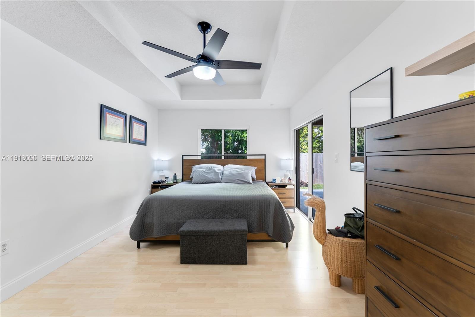 15475 Southwest 138th Terrace Miami, FL 33196 - Photo 21 of 31 a bed room with a bed and a ceiling fan