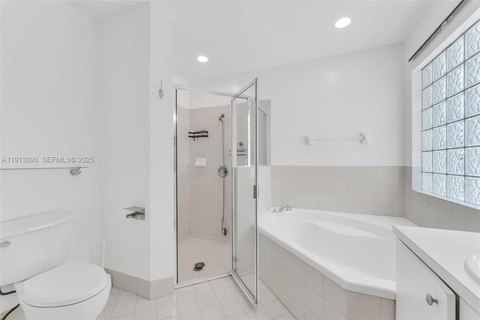 15475 Southwest 138th Terrace Miami, FL 33196 - Photo 24 of 31 a bathroom with a bathtub and a toilet