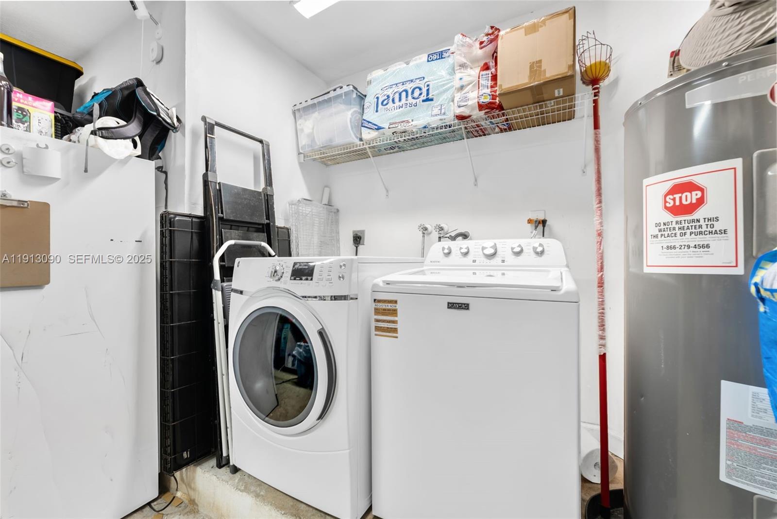 15475 Southwest 138th Terrace Miami, FL 33196 - Photo 26 of 31 a utility room with dryer and washer