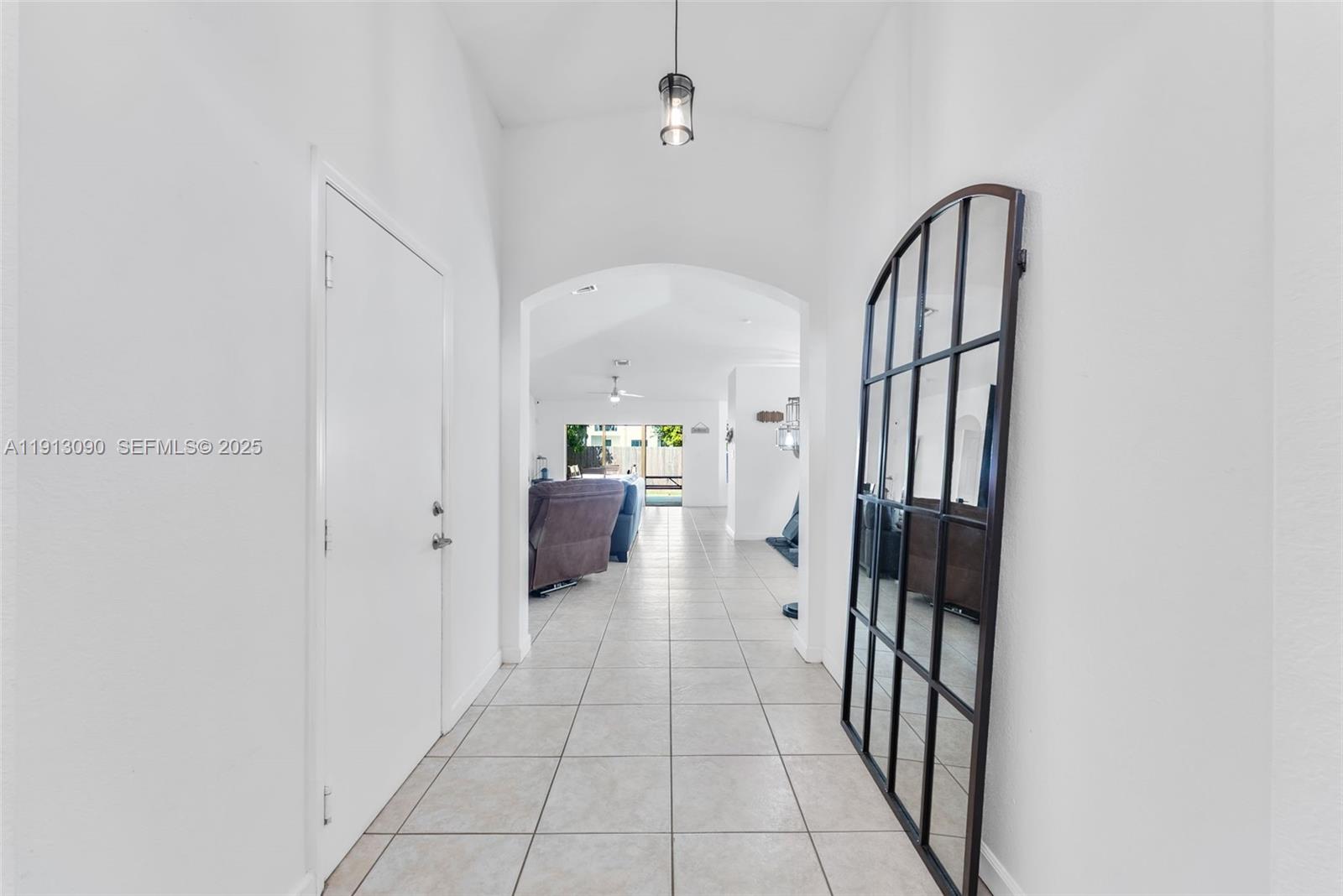 15475 Southwest 138th Terrace Miami, FL 33196 - Photo 5 of 31 a view of a hallway with a kitchen and dining room