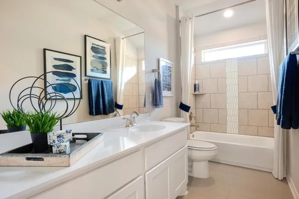 a bathroom with a sink a toilet and a bathtub