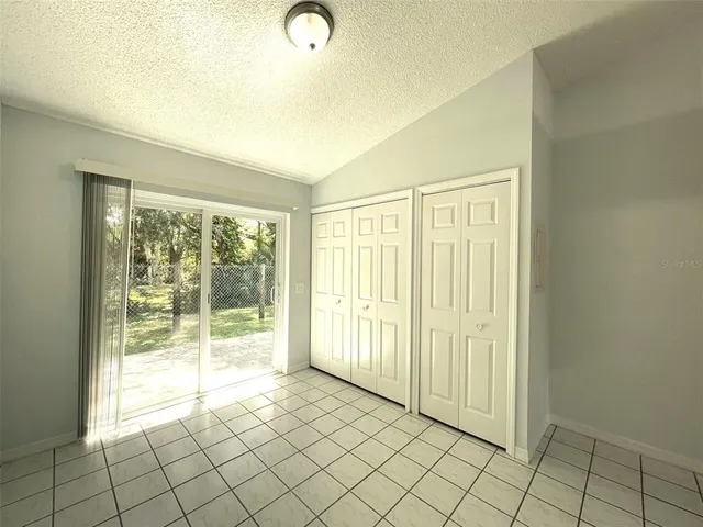 a bathroom with a granite countertop toilet and a sink