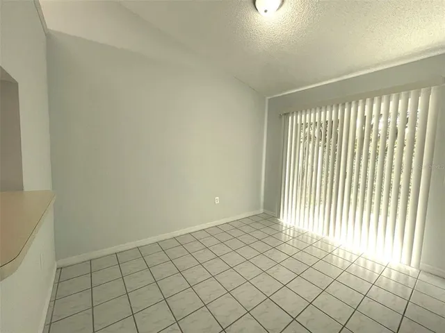 a white toilet sitting next to a shower