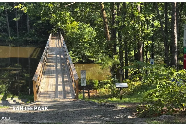 a view of a park with large trees