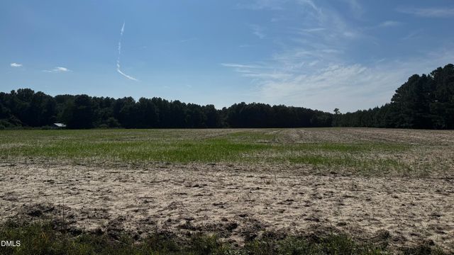 a view of outdoor space with swimming pool and green space