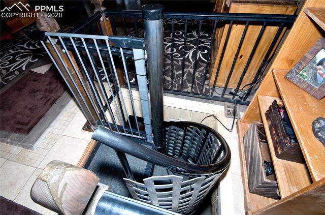 9780 Hahn Road Calhan, CO 80808 - Photo 15 of 27 Spiral stair case to basement