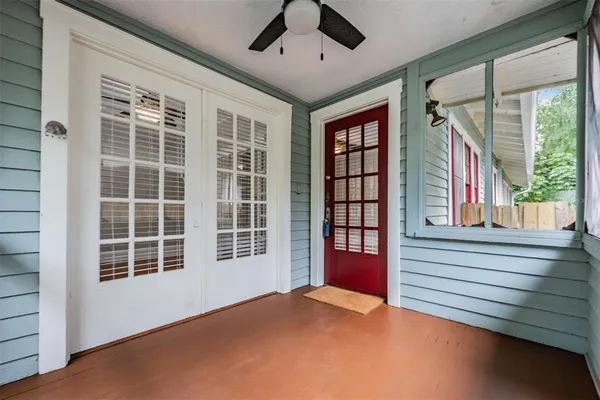 a view of an empty room with a window and balcony
