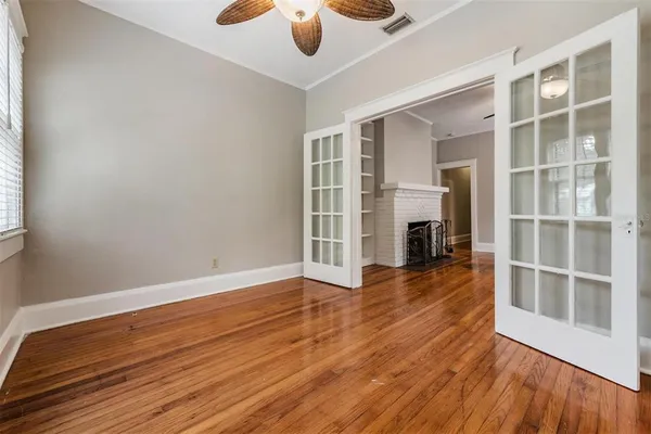 wooden floor in an empty room with a window