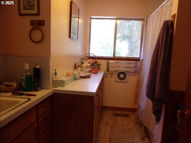 713 Little River Road Glide, OR 97443 - Photo 11 of 36 a bathroom with a sink and a mirror
