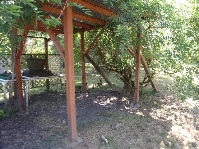 713 Little River Road Glide, OR 97443 - Photo 19 of 36 a backyard of a house with lots of green space