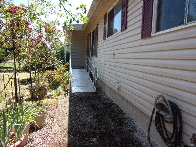 713 Little River Road Glide, OR 97443 - Photo 2 of 36 a view of a pathway of a house with a yard