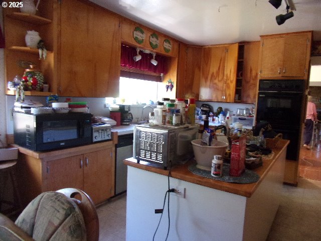 713 Little River Road Glide, OR 97443 - Photo 10 of 36 a room with furniture and a fireplace