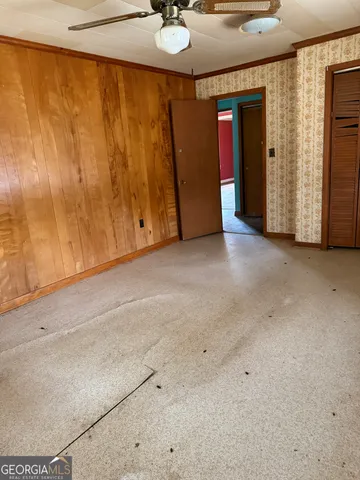 a view of an empty room with a fireplace