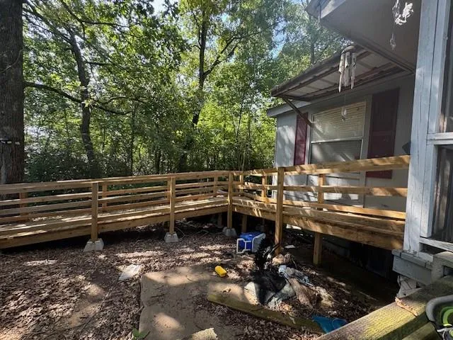 a view of a backyard with table and chairs and a stove