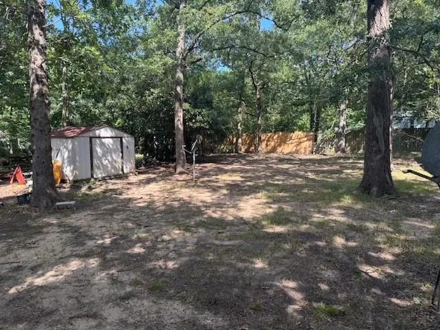 a backyard of a house with lots of green space