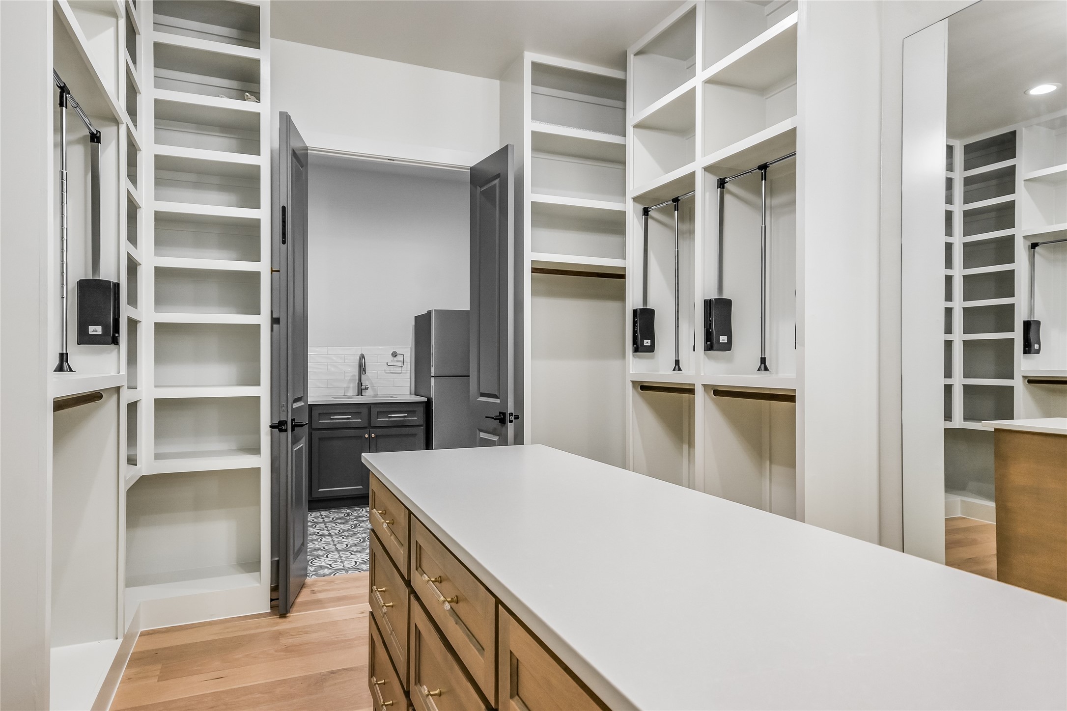 207 Gwendolyns Trail Wimberley, TX 78676 - Photo 26 of 40 a kitchen with refrigerator and cabinets