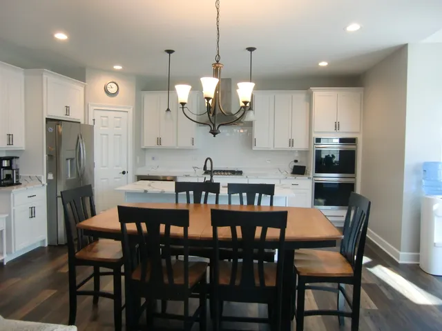 a view of a dining room and chairs in a kitchen