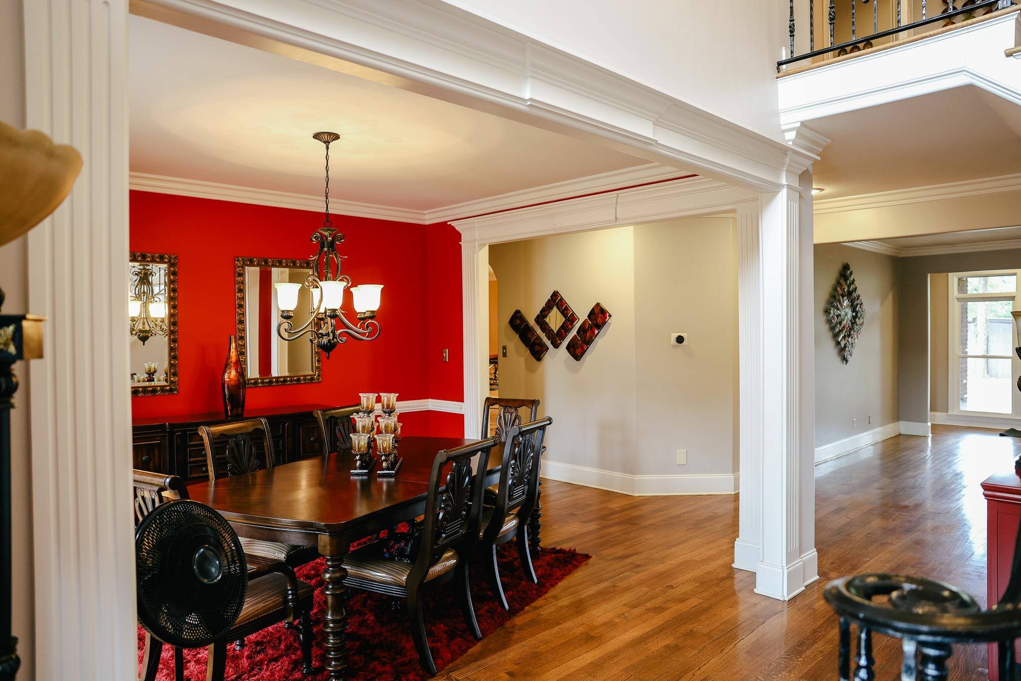 649 Ridge Springs Road Collierville, TN 38017 - Photo 14 of 35 Dining area featuring crown molding, wood finished floors, decorative columns, and a chandelier