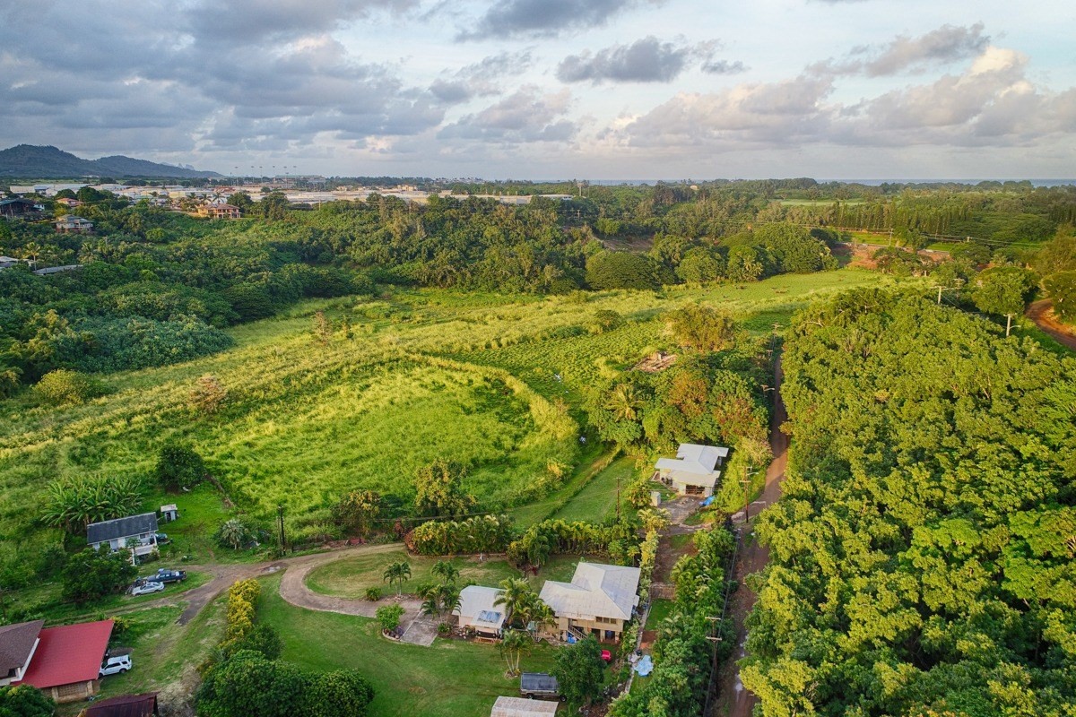 Kahumoku Road, Unit 10 Lihue, HI 96766 - Photo 11 of 27 a view of a lake with a building in the background