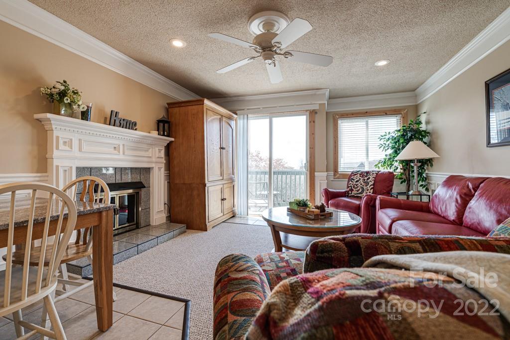 301 Pinnacle Inn Road, Unit 1315 Beech Mountain, NC 28604 - Photo 1 of 47 a living room with furniture and a large window